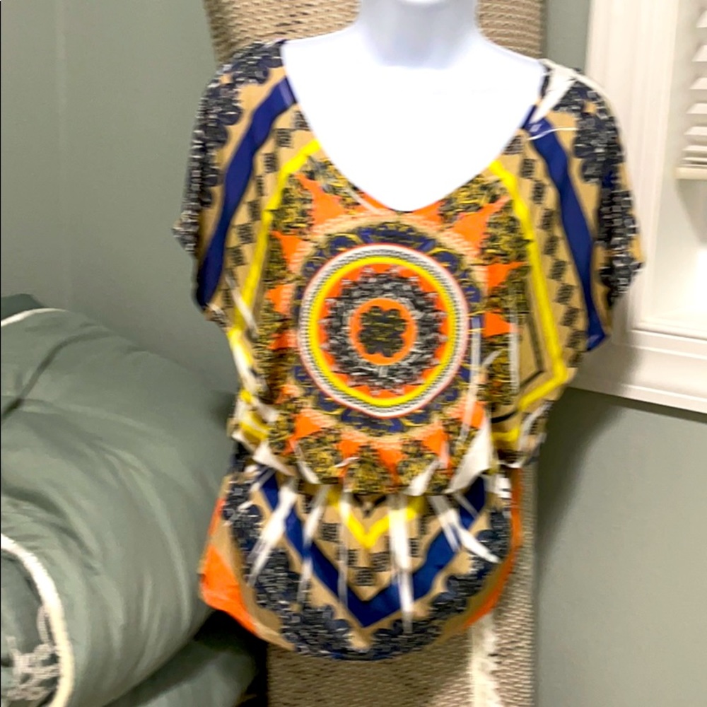 A Blue Sketch peplum cold shoulder shirt.